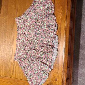 Lily Pulitzer floral mini skirt. Size large  13 inches long. 14 inches across